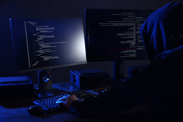 Hacker with computers in dark room. Cyber crime - Fotografie, Obrázek