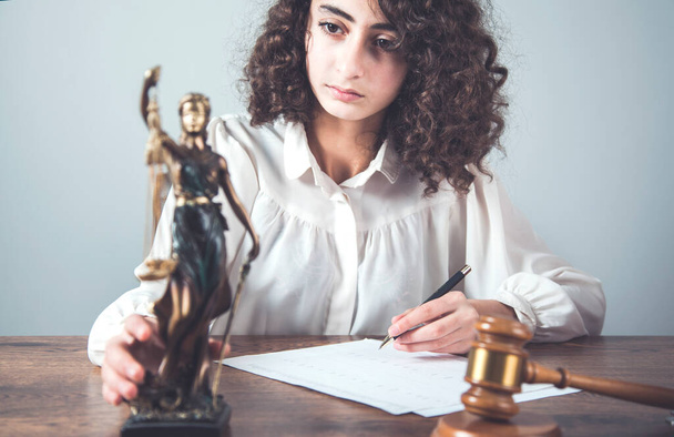woman hand justice lady and document on desk - Fotó, kép