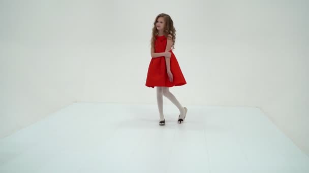 Pretty Girl in Fashionable Dress Standing and Smiling at Camera - Video