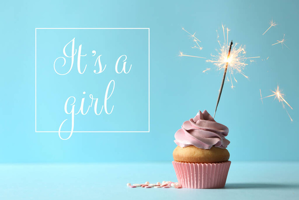 Baby shower cupcake with sparkler for girl on light blue table - Fotografie, Obrázek