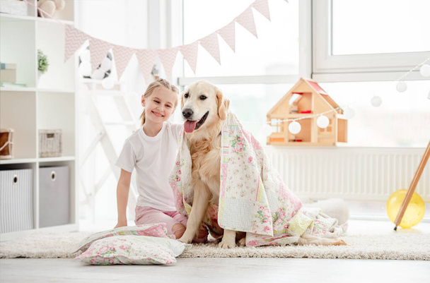 Smiling little girl with cute dog - Photo, Image