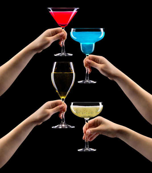 Set of hands holding cocktails isolated on black background - Фото, зображення