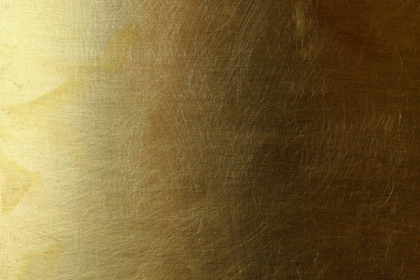 Scratched textured surface of old brass, background - Zdjęcie, obraz
