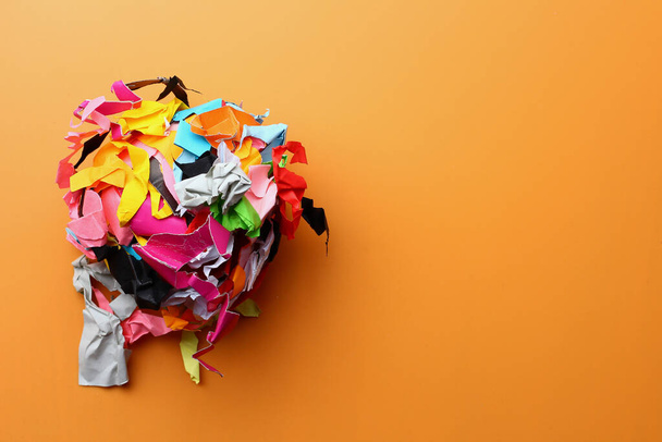 Crumpled torn pieces of colored paper, abstract concept, background, symbolic metaphor - 写真・画像