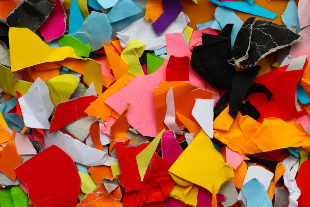 Torn small pieces of multi-colored paper, bright colorful background - Photo, Image