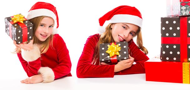 Christmas Santa kid sister girls happy excited with ribbon gifts - Photo, image