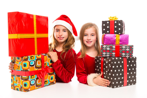 Christmas Santa kid girls with many gifts stacked - Φωτογραφία, εικόνα