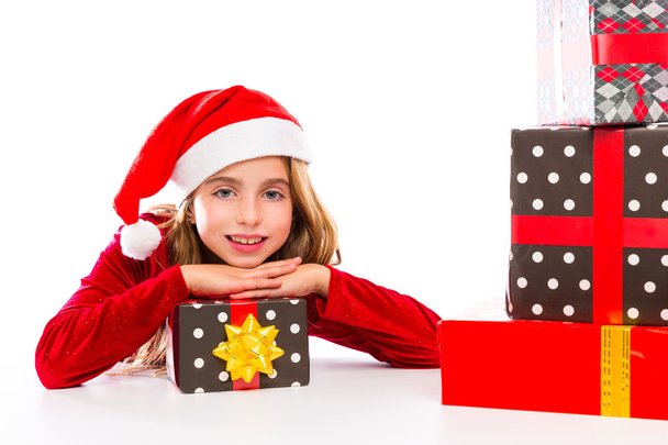 Christmas Santa kid girl happy excited with ribbon gifts - 写真・画像