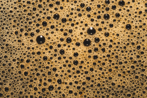 Coffee foam with bubbles macro texture. froth drink background - Foto, Imagen