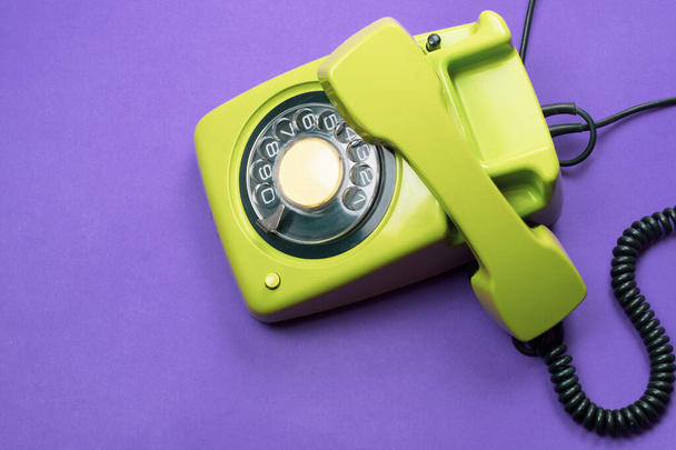 Phone with handset. vintage green telephone with phone receiver. office background. old communication technology. copy space - Foto, Imagen