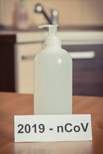 Disinfectant liquid with alcohol in bottle. Disinfection hands and stop spreading outbreak coronavirus. Covid-19. 2019-nCoV - Фото, изображение