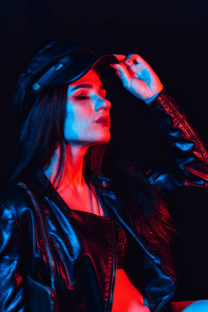 stylish Portrait of a young girl in a leather jacket and cap - Fotografie, Obrázek