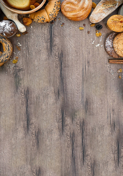 Fresh brad on the wooden table. Bakery, sliced, bun - Fotó, kép