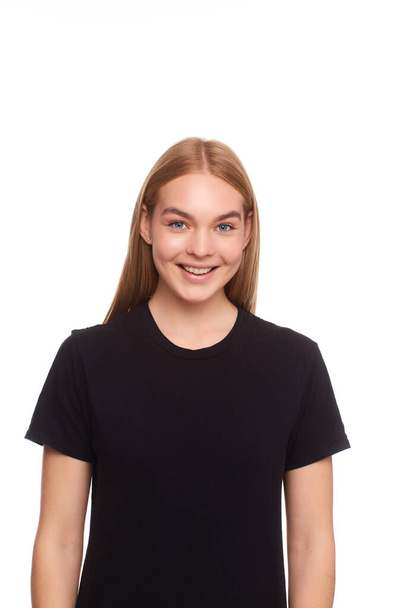 Young beautiful blond female posing with a blank black t-shirt. Ready for your design or artwork. - Photo, Image