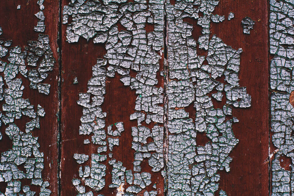  texture of dark old painted wood close up, ragged paint on boards - Photo, Image