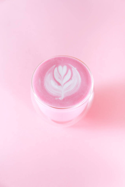 matcha latte with rosetta art on pink background - Photo, Image