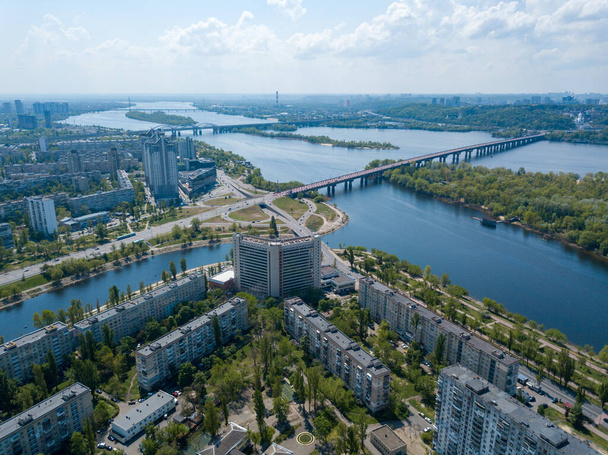 Housing estate in Kiev on the banks of the Dnieper River. Sunny spring day. Aerial drone view. - Fotografie, Obrázek