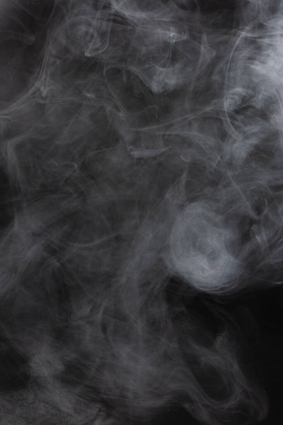 White steam on a black background. Copy space. - Zdjęcie, obraz