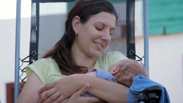 Mother Sings Lullaby To Her Nice Baby With Love And Cradles Him To Sleep - Záběry, video