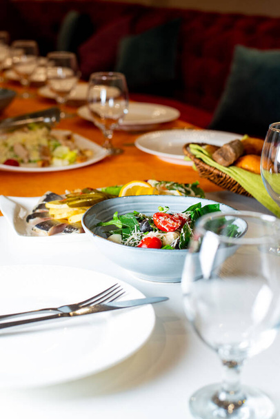 table set for a feast, salad, plate glasses - Zdjęcie, obraz