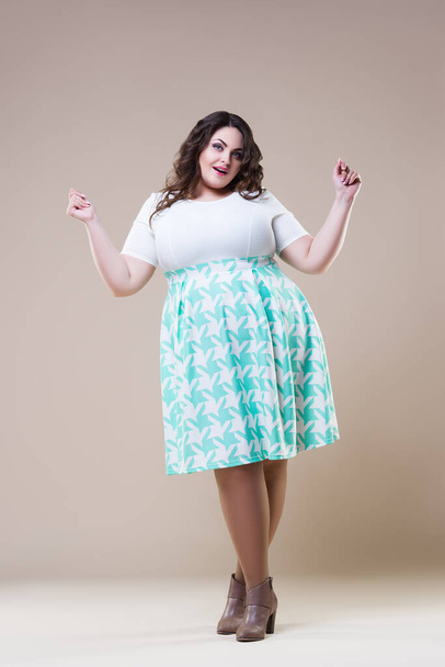 Happy plus size fashion model in casual clothes, fat woman on beige background, body positive concept, full length portrait - 写真・画像
