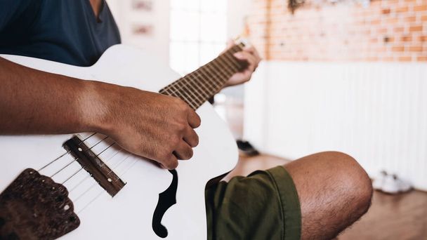  Close-up of men playing acoustic guitar. - Fotografie, Obrázek