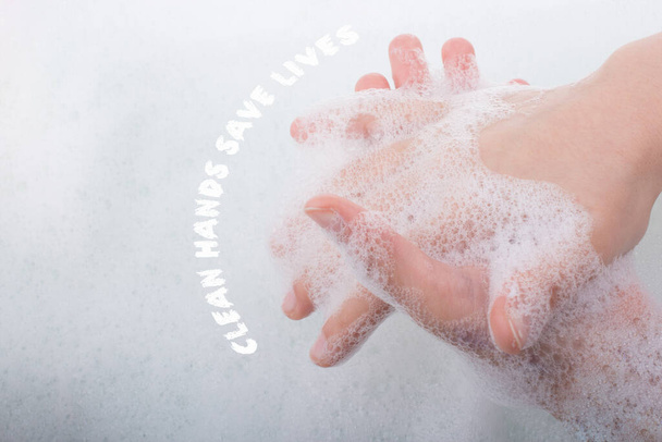 Hand washing and soap foam on a foamy background - Photo, Image