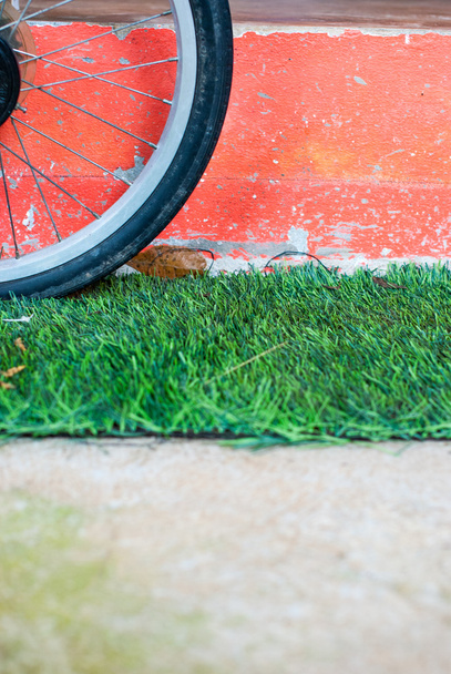 Bicycle wheel on the grass - Photo, Image