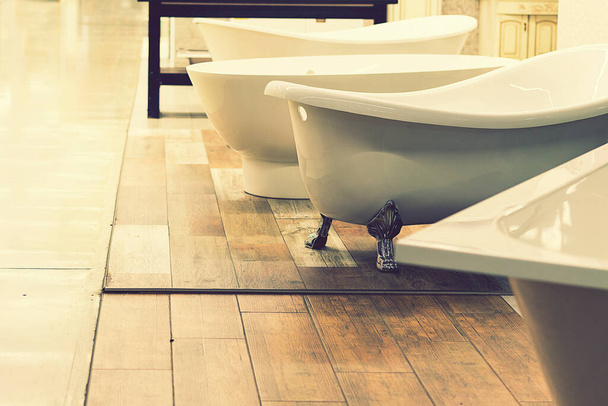 Sanitary engineering shop. White bathrooms. toned - Photo, Image