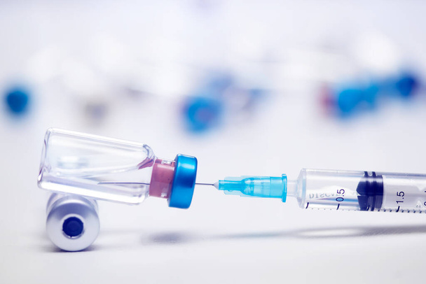 Vaccine and syringe injection for prevention, immunization and treatment of coronavirus infection (COVID-19, nCoV 2019) - Photo, Image