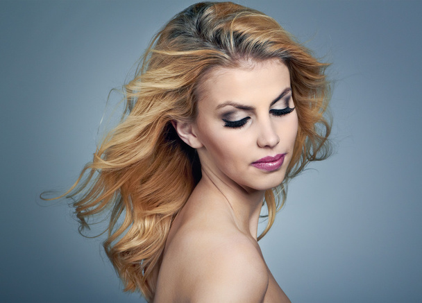 Beautiful young woman with blonde hair and evening make up - Photo, image