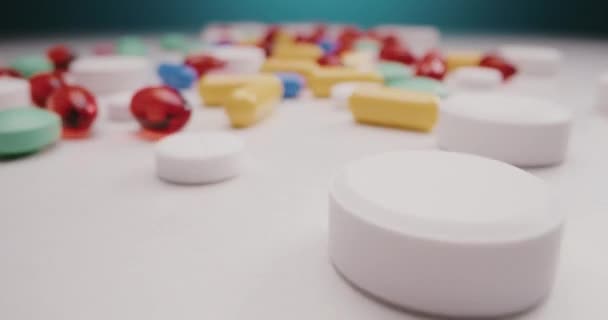 Pills spread on tabletop - Filmati, video