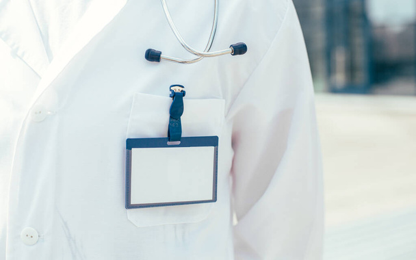 close up. blank badge on the chest of the doctor paramedic . - Φωτογραφία, εικόνα