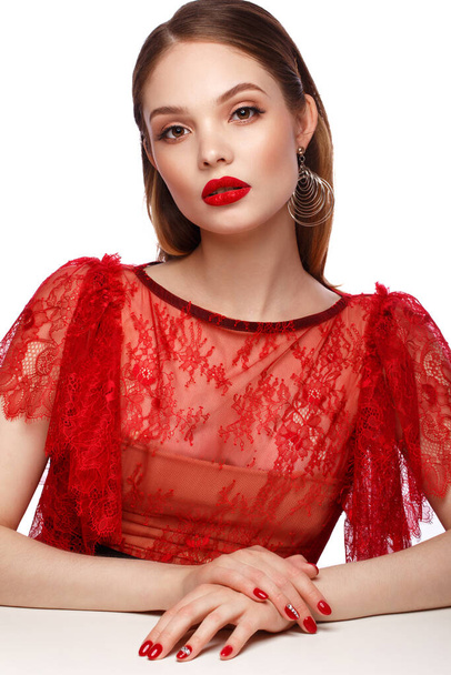 Beautiful girl in red dress with classic make-up and red manicure. Beauty face. - Foto, Bild