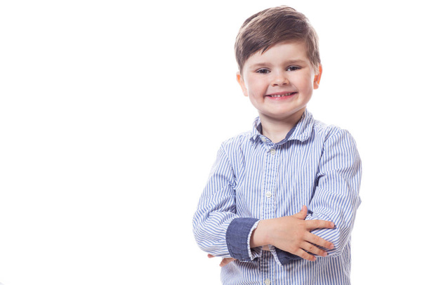 Young cute happy little boy possing on white background.  - Fotoğraf, Görsel