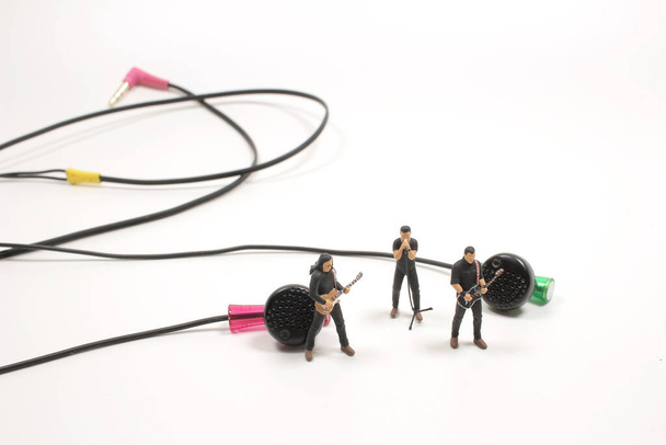 the mini figure withe band show near earphone  - Photo, Image
