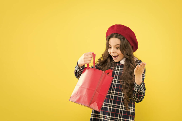 Black friday. Sale discount. Shopping day. Little french lady adore shopping. Birthday girl. Favorite brands hottest trends. Girl with shopping bag. Explore fashion industry. Shopping and purchase - Zdjęcie, obraz