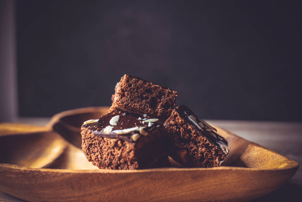 Homemade brownies chocolate cake fudge sweet dessert for couple in valentines day. Delicious bakery baking with cacao dark brown fudge cake on wooden plate. - Φωτογραφία, εικόνα