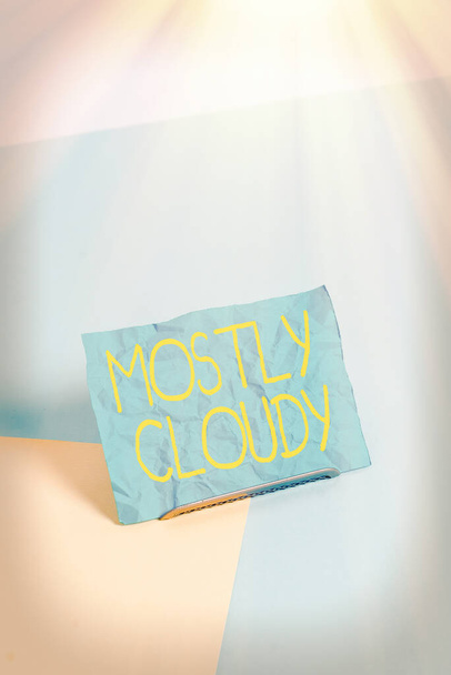 主に曇りを示す概念的な手書き文字。Business photo showcasing Shadowy Vaporous Foggy Fluffy Nebulous Clouds Skyscape Paper on buffer wire on soft pastel multi colours backdrop. - 写真・画像