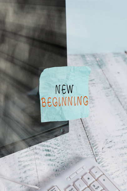 Text sign showing New Beginning. Conceptual photo Different Career or endeavor Starting again Startup Renew Notation paper taped to black computer monitor screen near white keyboard. - Φωτογραφία, εικόνα