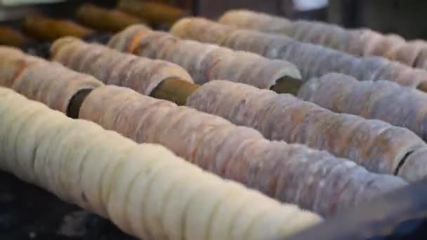 Traditional sweet dough baked on the grill, Czech Christmas Trdelnik - Footage, Video