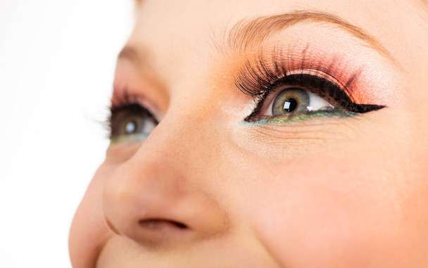 Beautiful female eye with pinup makeup. Close up retro pin up make up. - Photo, Image