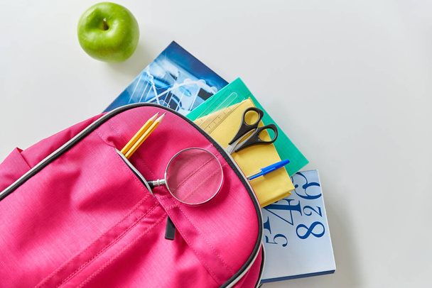 backpack with books, school supplies and apple - Φωτογραφία, εικόνα