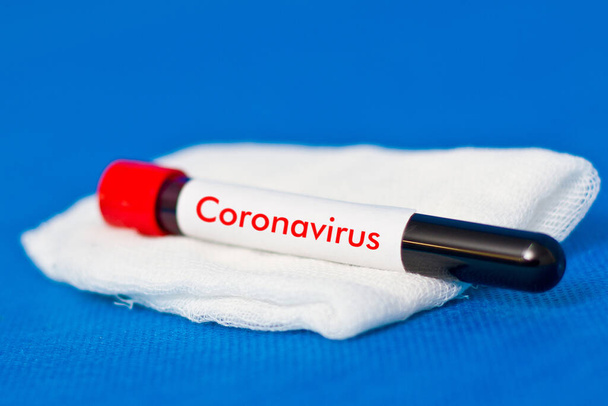 Test tube with blood on gauze cloth. Analysis for coronavirus - Photo, Image
