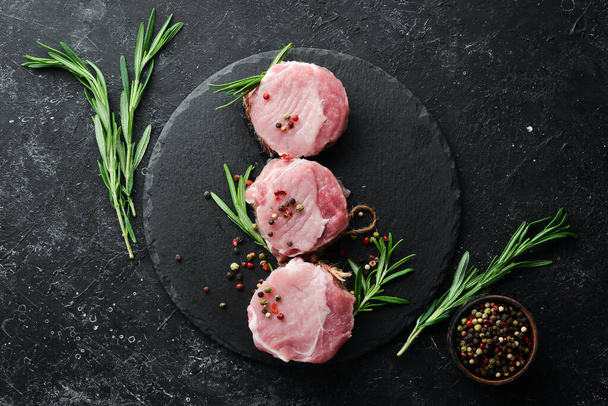 raw pork tenderloin medallions with spices for barbecue. Top view. Free space for your text. - Zdjęcie, obraz
