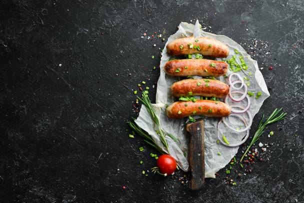 Grilled barbecue sausages with rosemary and spices. Top view. Free space for your text. - Фото, изображение