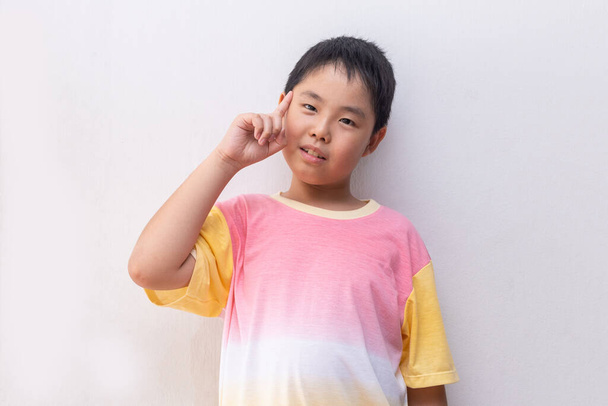 Young and cute Asian boy thinking - Photo, Image
