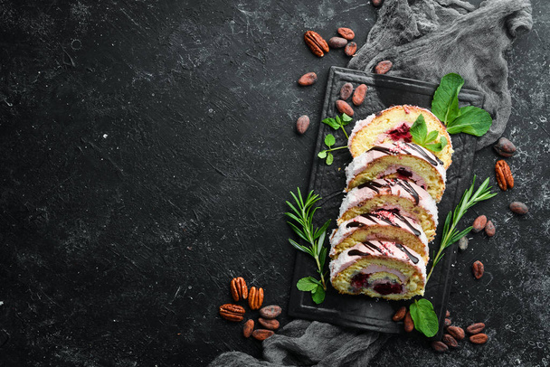 Sweet cake roll with cream and cherries. Top view. Free space for your text. - Foto, Bild