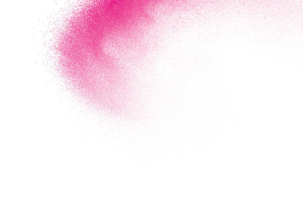 Pink dust particles splash on white background.Pink powder splash. - Photo, Image