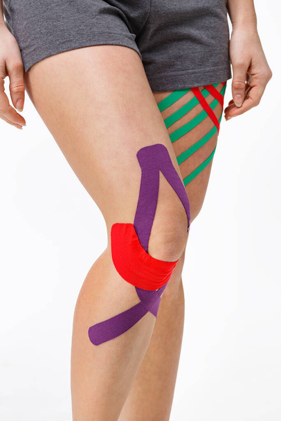 Kinesiology taping.Close up view of kinesiology tape on patient - Zdjęcie, obraz